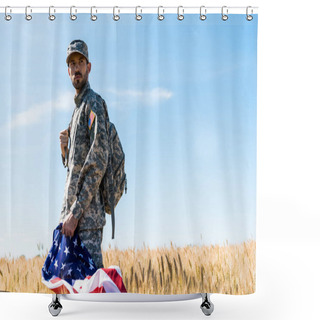 Personality  Selective Focus Of Soldier In Uniform Holding American Flag While Standing In Field  Shower Curtains