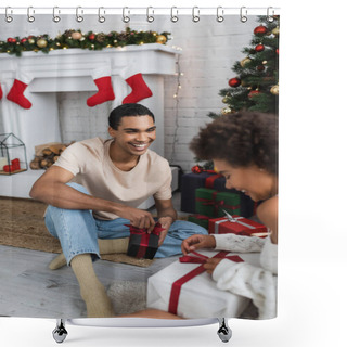 Personality  Smiling African American Man Looking At Girlfriend Opening Gift Box Near Christmas Tree Shower Curtains