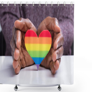 Personality  Close-up Of A Man's Hand Protecting Colorful Strip Heart Over The White Desk Shower Curtains