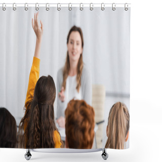 Personality  Schoolgirl Raising Hand Near Pupils And Teacher On Blurred Background Shower Curtains