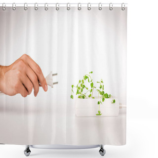 Personality  Cropped View Of Man Holding Power Plug Near Green Plant Growing In Socket In Power Extender On White Background Shower Curtains