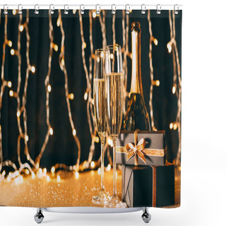 Personality  Two Glasses Of Champagne, Presents And Bottle On Garland Light Background, Christmas Concept Shower Curtains