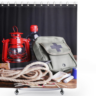 Personality  Emergency Preparation Equipment On Wooden Table, On Dark Background Shower Curtains