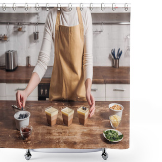 Personality  Cropped Shot Of Woman In Apron Preparing Triple Chocolate Mousse With Blueberries In Glasses  Shower Curtains