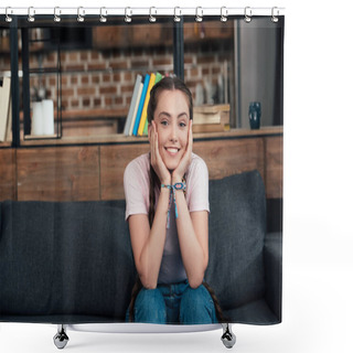 Personality  Smiling Teenage Girl With Hands On Cheeks Looking At Camera And Sitting On Sofa At Home Shower Curtains