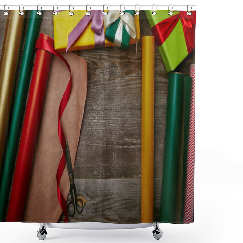 Personality  top view of arrangement of wrapping papers, christmas presents with ribbons and scissors on wooden tabletop shower curtains