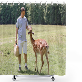 Personality  A Man Feeding Cute Spotted Deer Bambi At Contact Zoo. Happy Traveler Man Enjoys Socializing With Wild Animals In National Park In Summer. Shower Curtains