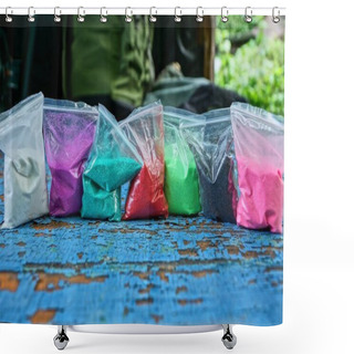 Personality  A Row Of Plastic Bags Of Colored Sand On A Blue Table Shower Curtains
