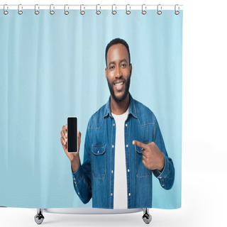 Personality  Cheerful African American Man Pointing At Smartphone With Blank Screen Isolated On Blue Shower Curtains