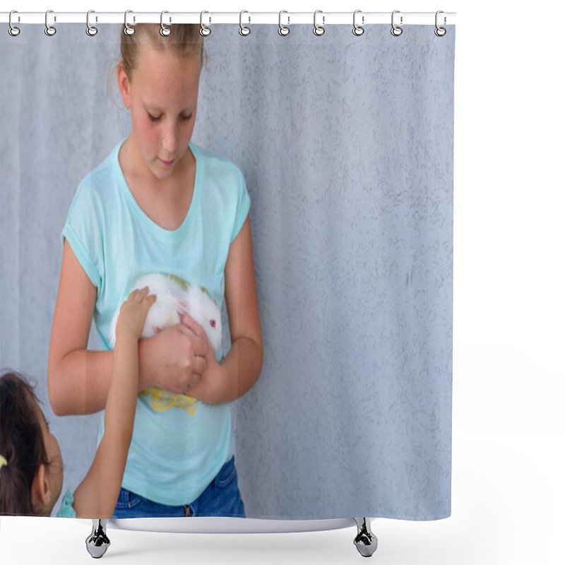 Personality  Happy young girl holding bunny furry rabbit.Two happy young girls playing with white bunny,. shower curtains