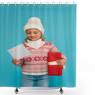 Personality  Pleased Child In Warm Sweater And Hat Holding Present And Letter To Santa Clause Isolated On Blue Shower Curtains