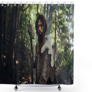 Personality  Portrait Of Primeval Caveman Wearing Animal Skin And Fur Hunting With A Stone Tipped Hammer In The Prehistoric Forest. Prehistoric Neanderthal Ready To Attack Prey Shower Curtains