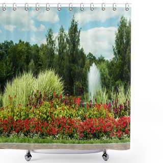 Personality  Red Blooming Flowers Near Plants And Fountain Against Blue Sky  Shower Curtains