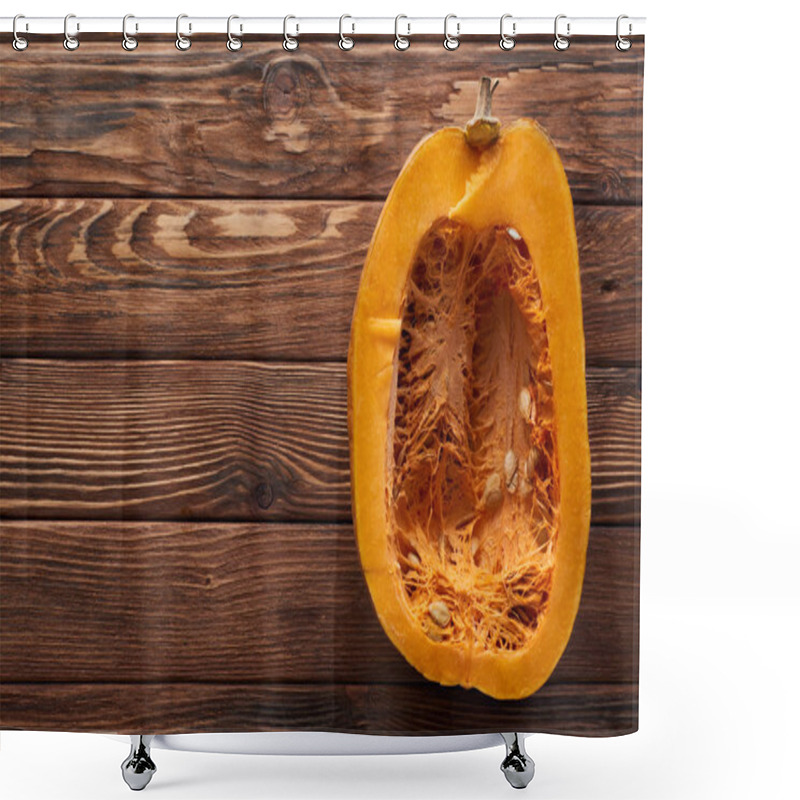 Personality  top view of ripe pumpkin half on brown wooden surface shower curtains