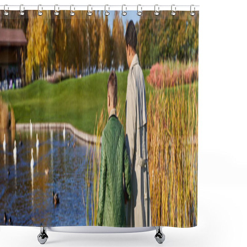 Personality  back view of mother and son in outerwear walking together near lake with swans and ducks, banner shower curtains