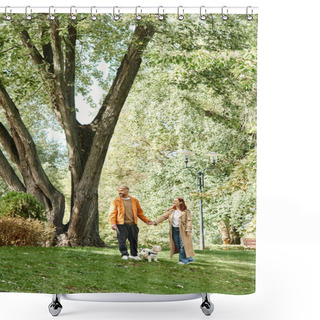 Personality  A Couple Takes A Leisurely Walk With Their Dog In A Lush Park. Shower Curtains