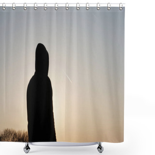 Personality  A Hooded Man Standing, Back To Camera. Watching A Plane With A Contrail In The Sky At Sunset Shower Curtains