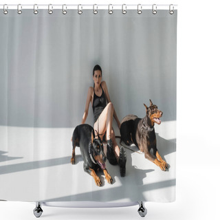 Personality  Young Woman In Black Bodysuit Sitting Near Doberman Dogs On Grey Background With Shadows Shower Curtains