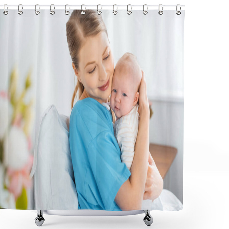 Personality  happy young mother sitting on hospital bed and hugging adorable baby  shower curtains