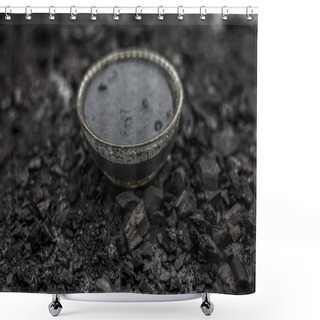 Personality  Close Up Of Activated Charcoal In A Glass Bowl On The Wooden Surface Along With Some Raw Powder Of Charcoal Or Coal Spread On The Surface. Shower Curtains