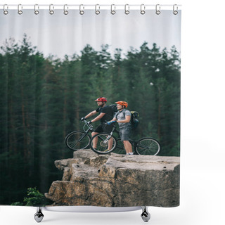 Personality  Side View Of Happy Young Trial Bikers Standing On Rocky Cliff With Blurred Pine Forest On Background And Looking Away Shower Curtains