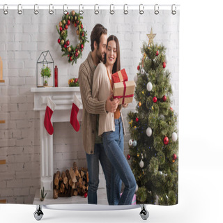 Personality  Man Embracing Happy Wife Holding Presents Near Christmas Tree And Decorated Fireplace Shower Curtains