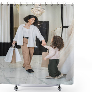 Personality  Happy Middle Eastern Woman With Brunette Hair In Beige Pants With White Shirt Holding Shopping Bags And Hand Of Little Daughter Near Wedding Dresses In Bridal Salon, Modern Bride, Mother Shower Curtains