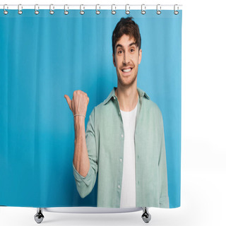 Personality  Happy Young Man Pointing With Thumb While Looking At Camera On Blue Shower Curtains