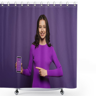 Personality  KYIV, UKRAINE - NOVEMBER 29, 2019: Smiling Girl Pointing With Finger At Smartphone With Instagram App On Screen On Purple Background Shower Curtains