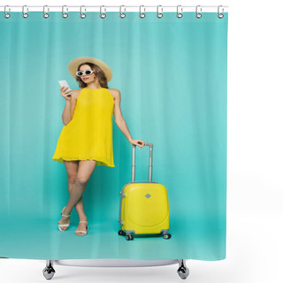 Personality  Woman In Sunglasses And Straw Hat Using Smartphone Near Suitcase On Blue Background  Shower Curtains