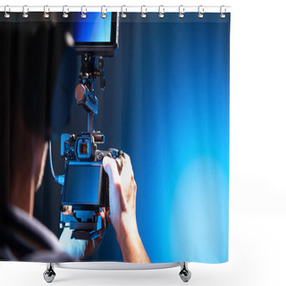 Personality  Video Camera Operator With Modern Digital SLR Camera In Hands And Additional Large Display. Videography Theme. Dark Blue Light In A Studio. Shower Curtains