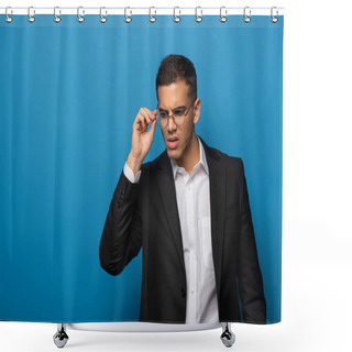 Personality  Thoughtful Businessman Adjusting Eyeglasses On Blue Background Shower Curtains