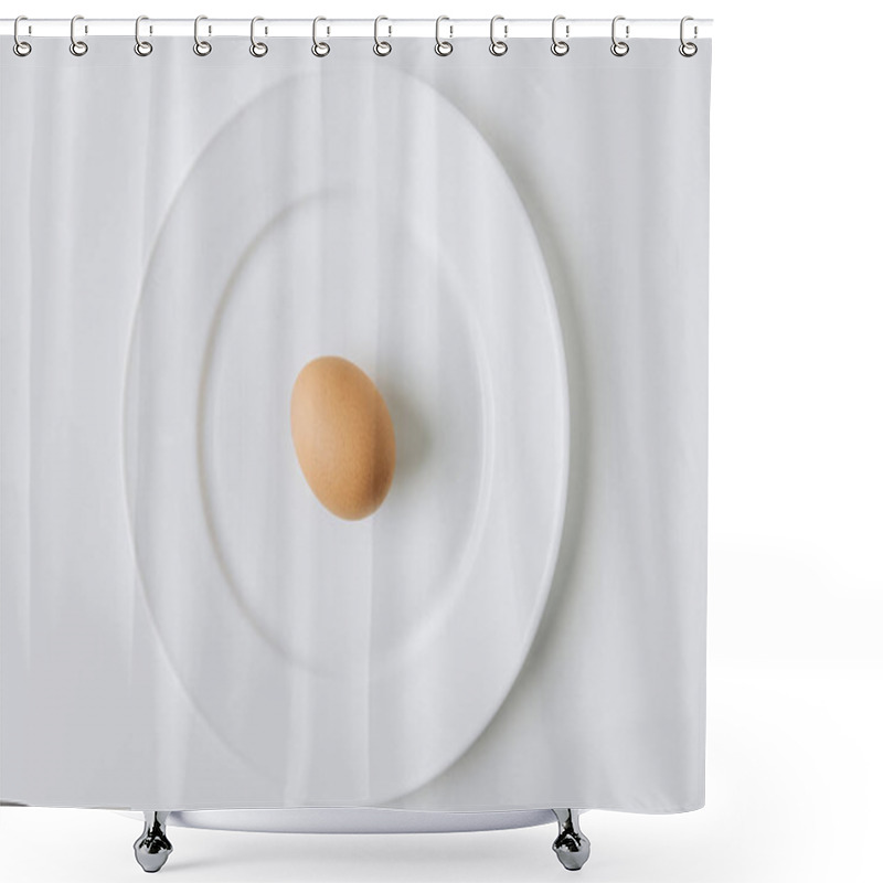 Personality  brown egg laying on white plate on white background shower curtains