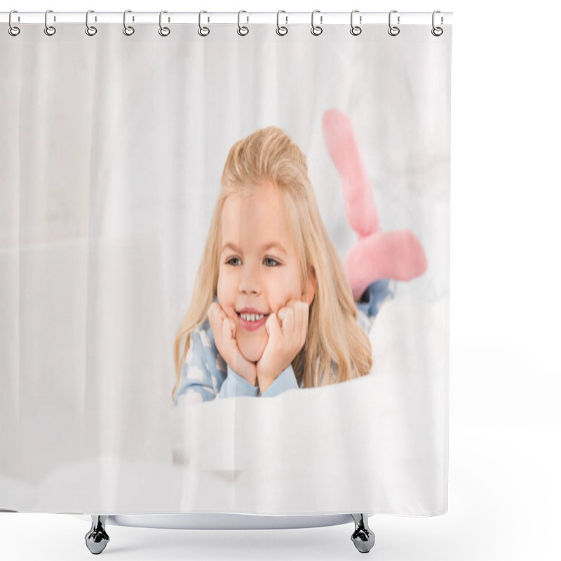 Personality  happy adorable child lying in bed and watching cartoons on laptop shower curtains