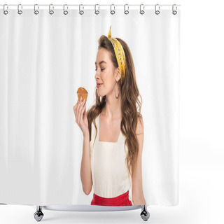 Personality  Young Pleased Housewife In Dress And Apron Looking At Muffin Isolated On White Shower Curtains