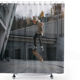 Personality  Skateboarder In Streetwear Outfit Performing Jump Trick In Urban Location Shower Curtains