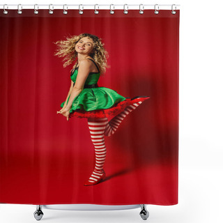 Personality  Joyful Curly Woman Dressed As New Year Elf Standing On One Leg Smiling At Camera On Red Backdrop Shower Curtains