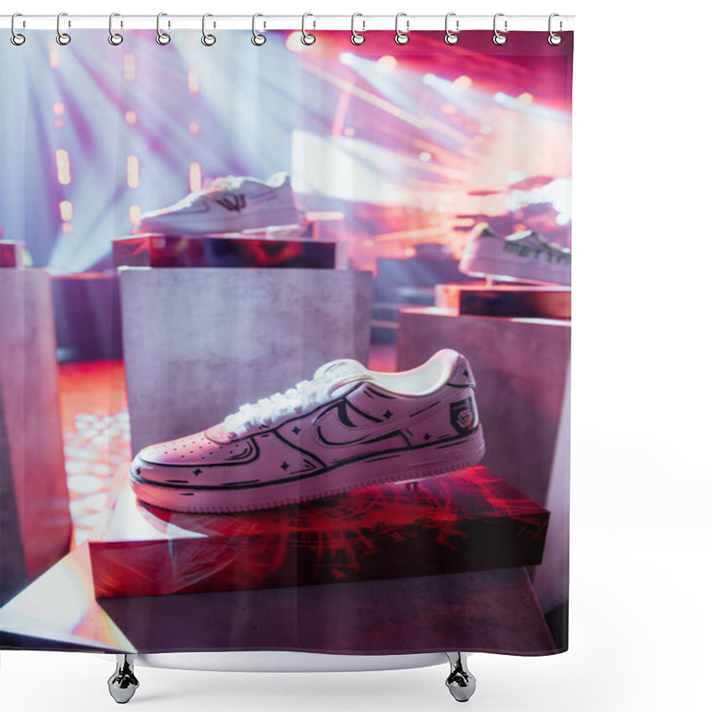 Personality  Riga, Latvia - December 18, 2023 - Pair Of White Sneakers With Black Detailing Displayed On A Pedestal With A Vibrant Red And White Light Show In The Background. Shower Curtains