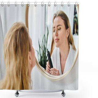 Personality  Attractive Blonde Woman In Cozy Bathrobe Using Flat Iron On Her Hair And Looking At Mirror Shower Curtains