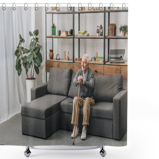 Personality  Happy Senior Man Smiling And Holding Walking Cane While Sitting On Sofa  Shower Curtains