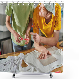 Personality  Young Craftsman Pointing With Finger At Printing Layer While Working With African American Colleague Near Clothes On Table In Print Studio, Thriving Small Enterprise Concept Shower Curtains