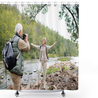 Personality  Cheerful Aged Active Woman With Outstretched Arms Looking At Her Husband With Camera While Both Standing By River Shower Curtains