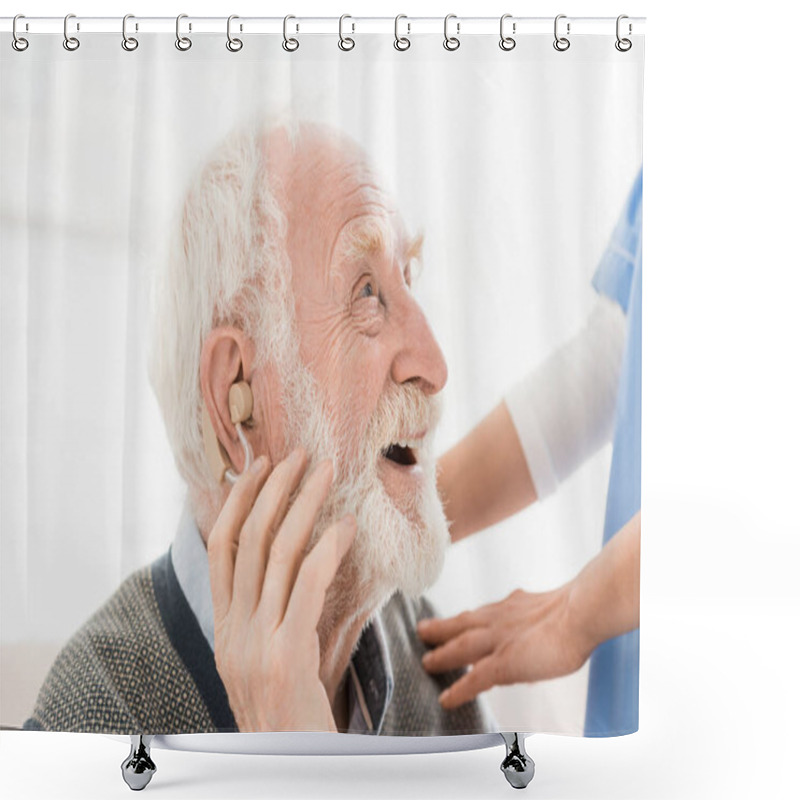 Personality  Profile of happy and cheerful man with hearing aid in ear, looking away shower curtains