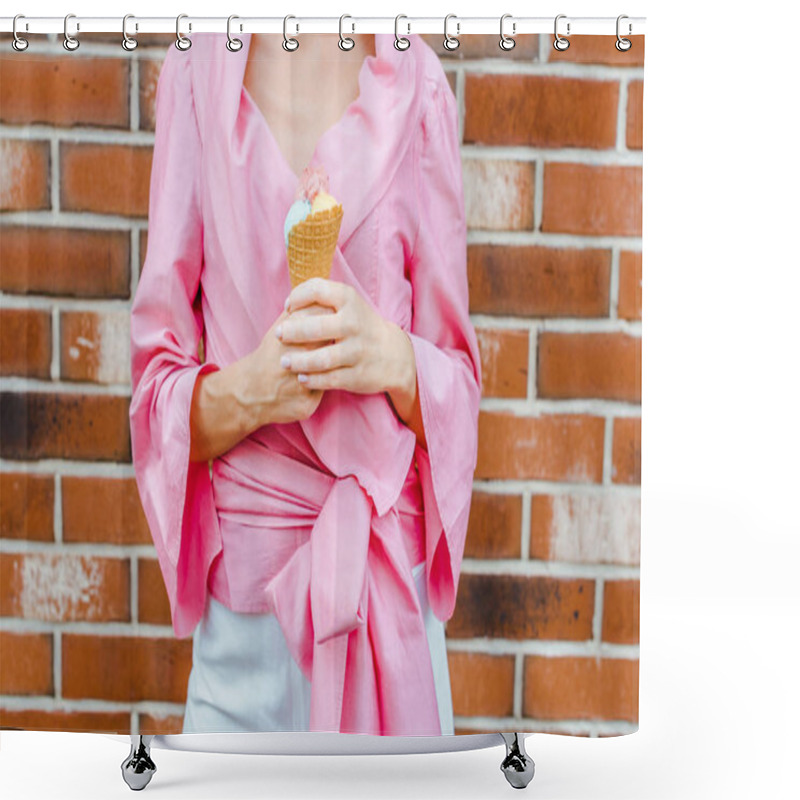 Personality  cropped shot of woman in pink holding ice cream in front of brick wall shower curtains