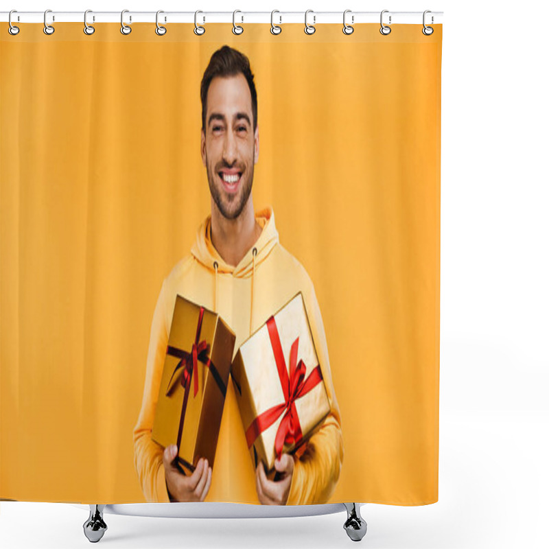 Personality  Cheerful Man Holding Wrapped Gifts Isolated On Yellow Shower Curtains