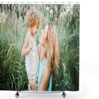 Personality  Side View Of Smiling Mother Holding Adorable Child In Green Grass Shower Curtains
