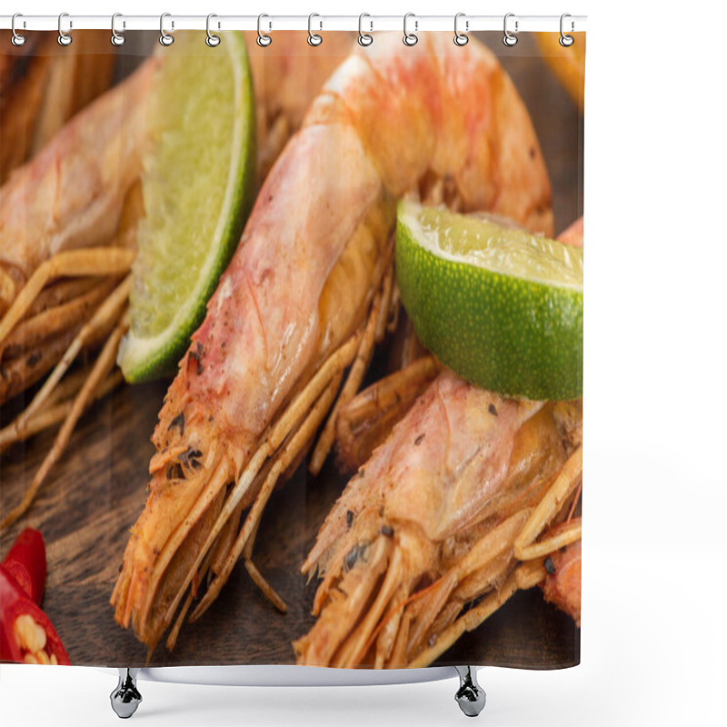 Personality  close up view of fried shrimps with chili and lime on wooden board shower curtains