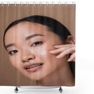 Personality  Portrait Of Young Asian Woman Applying Face Cream On Cheek Isolated On Brown  Shower Curtains
