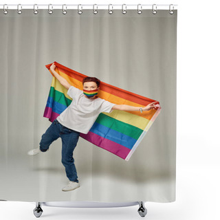 Personality  Full Length Of Redhead Queer Model In Rainbow Colors Medical Mask Holding LGBT Flag On Grey Shower Curtains