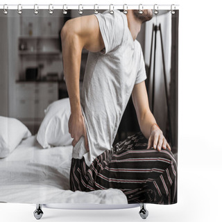 Personality  Cropped Shot Of Young Man In Pajamas Suffering From Backache While Sitting On Bed In The Morning Shower Curtains